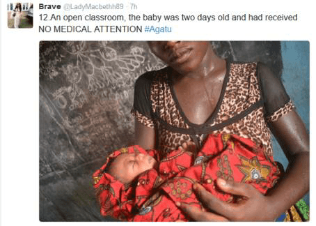 Woman holding her new-born-baby in classroom